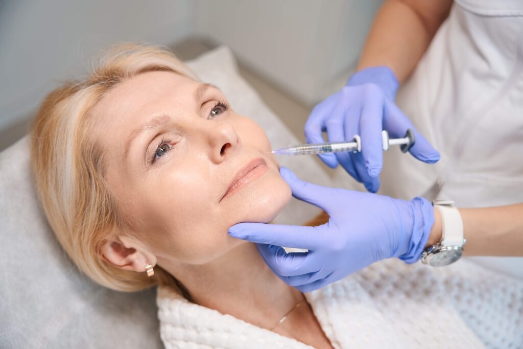 Practitioner administering Rejuran injections at Skinoza Clinic London