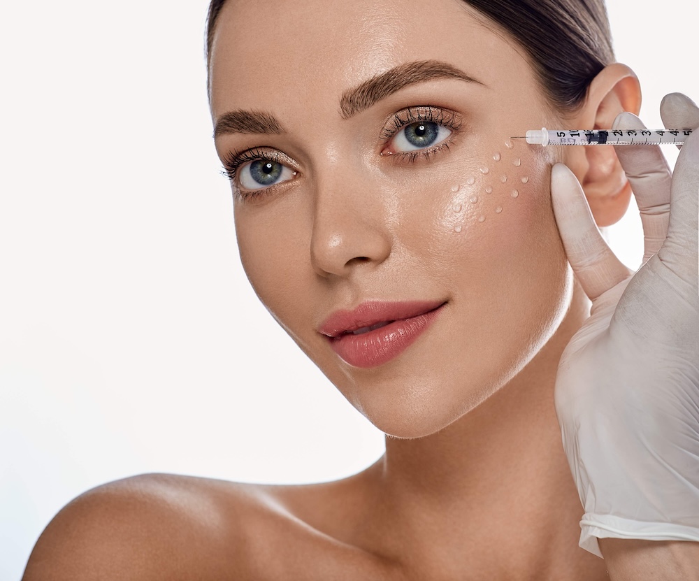 Woman receiving a Rejuran skin booster facial treatment